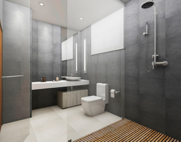 Modernes Badezimmer mit stilvoller grauer Fliesenwand in einem FINNHOLZ Blockhaus.